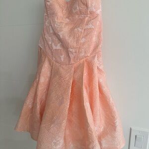 Peach homecoming or party dress. Bow in back